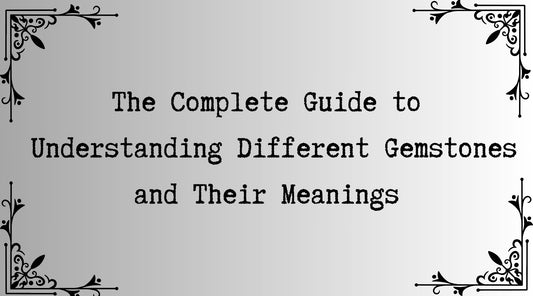 "Text graphic reading 'The Complete Guide to Understanding Different Gemstones and Their Meanings,' framed by elegant black corner decorations on a soft gradient background.